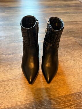 Trary Black Quilted Pointed Toe Ankle Booties with Ring Zip Accent
